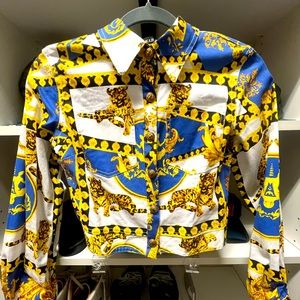 Royal blue and gold jacket with gold buttons